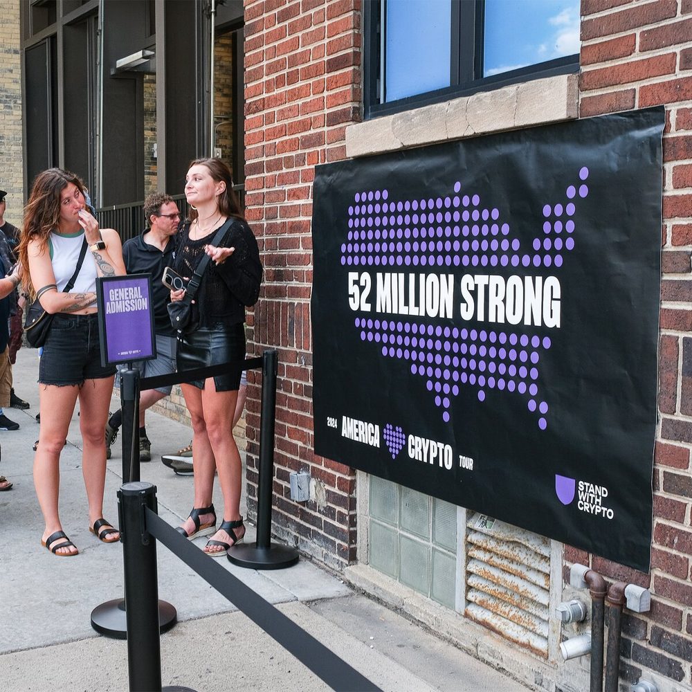 Stand With Crypto signage at an America Loves Crypto Tour event